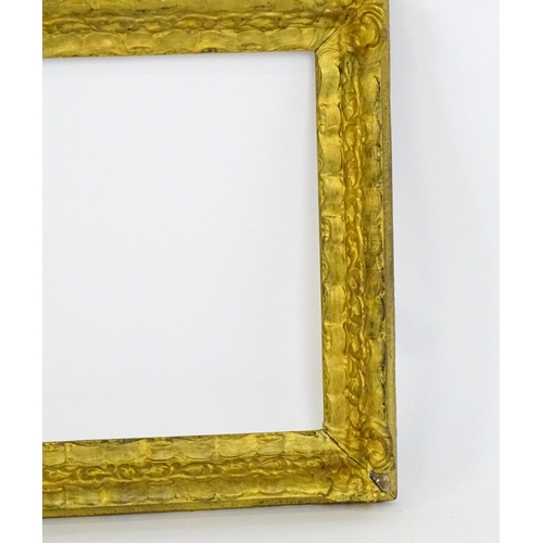 2253 - A 20thC gilt composite frame with foliate and ribbon fold detail. Rebate approx. 15