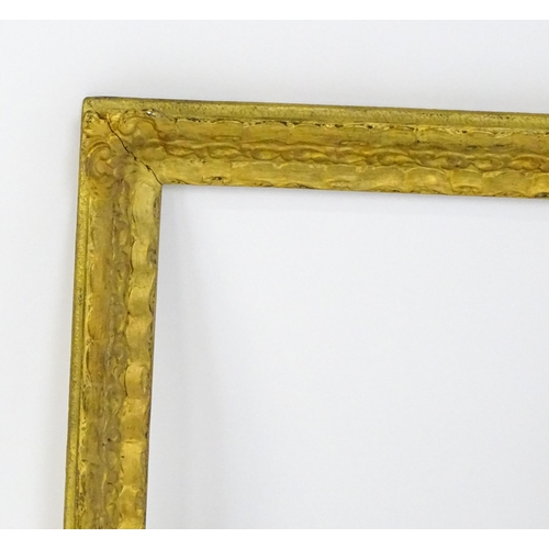 2253 - A 20thC gilt composite frame with foliate and ribbon fold detail. Rebate approx. 15