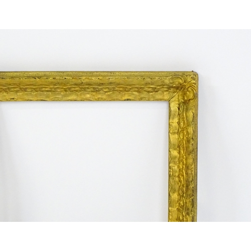 2253 - A 20thC gilt composite frame with foliate and ribbon fold detail. Rebate approx. 15