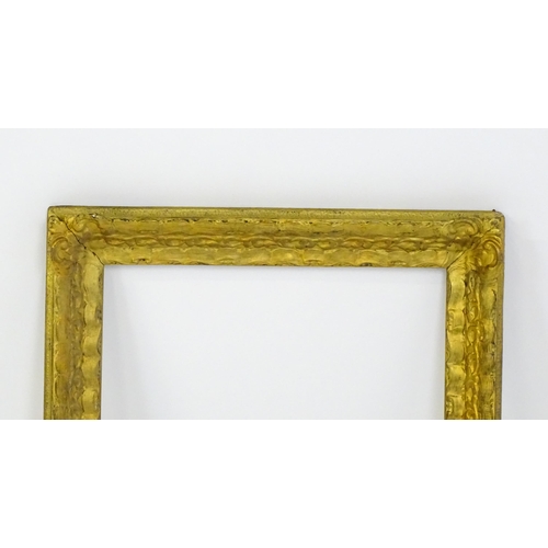 2253 - A 20thC gilt composite frame with foliate and ribbon fold detail. Rebate approx. 15