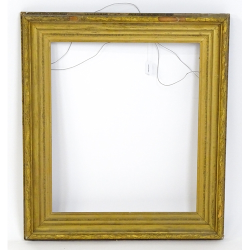 2254 - A 19thC gilt composite frame with banded foliate detail. Rebate approx. 24 3/4