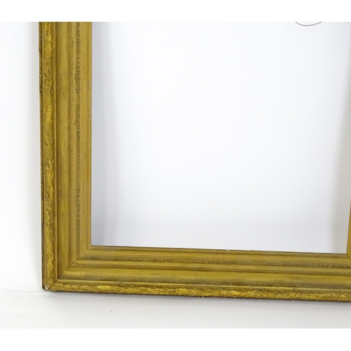 2254 - A 19thC gilt composite frame with banded foliate detail. Rebate approx. 24 3/4