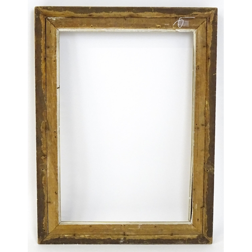 2255 - An early 20thC gilt composite frame with scrolling foliate detail. Rebate approx. 25 3/4