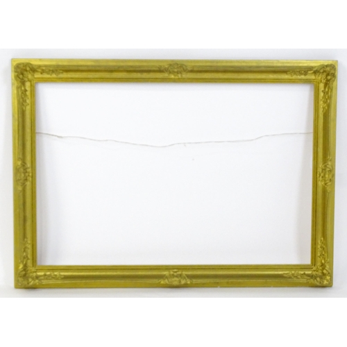 2257 - A 20thC gilt composite frame with swept detail. Rebate approx. 24