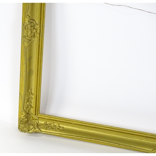 2257 - A 20thC gilt composite frame with swept detail. Rebate approx. 24