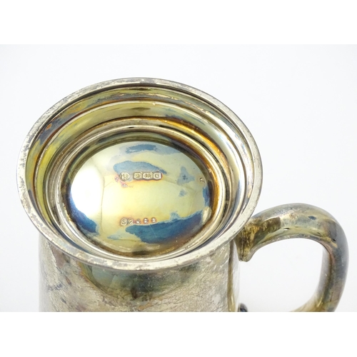 631 - A silver mug / tankard with loop handle hallmarked Sheffield 1920, maker Cooper Brothers & Sons Ltd.... 