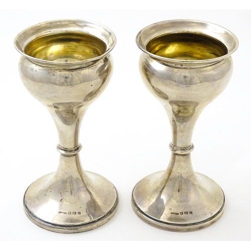 633 - A pair of silver vases hallmarked Birmingham 1926, maker S. Blanckensee & Sons Ltd. Approx. 6