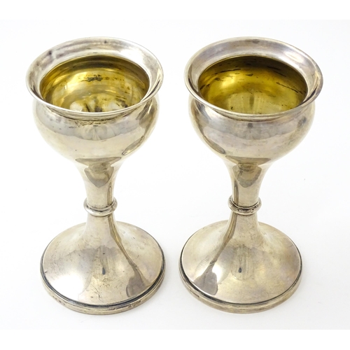 633 - A pair of silver vases hallmarked Birmingham 1926, maker S. Blanckensee & Sons Ltd. Approx. 6