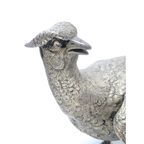 635 - A pair of silver models of pheasants hallmarked London 1989 / 1990, maker Edward Barnard & Sons Ltd.... 