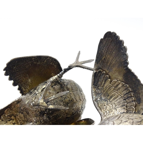 635 - A pair of silver models of pheasants hallmarked London 1989 / 1990, maker Edward Barnard & Sons Ltd.... 