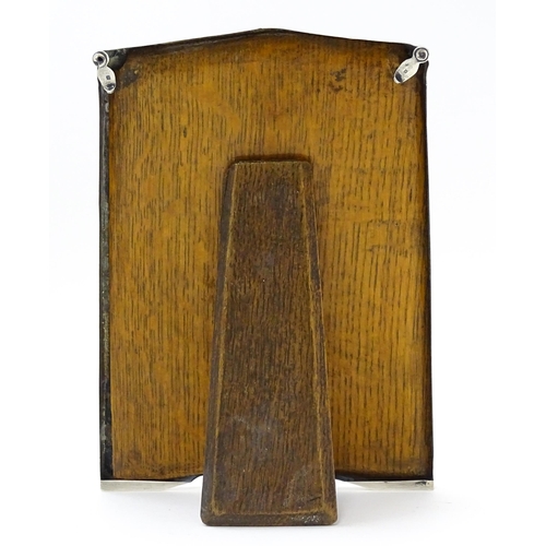 647 - An easel back photograph frame with silver surround hallmarked Birmingham 1917, maker James Deakin &... 