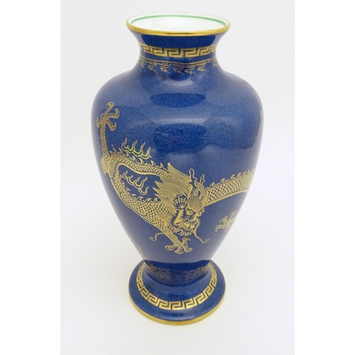 129A - A Wedgwood vase with Celestial Dragon decoration. Marked under and numbered Z4616. Approx. 8 1/2