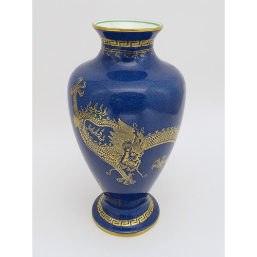 129A - A Wedgwood vase with Celestial Dragon decoration. Marked under and numbered Z4616. Approx. 8 1/2