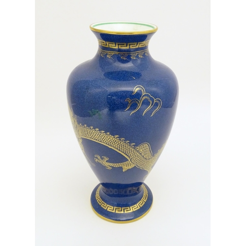 129A - A Wedgwood vase with Celestial Dragon decoration. Marked under and numbered Z4616. Approx. 8 1/2