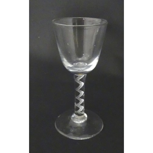 538 - A drinking glass with air twist detail to stem. Approx. 5 1/2