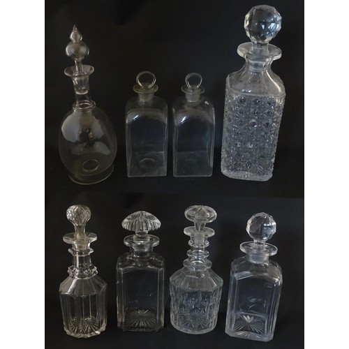 297 - A quantity of assorted Georgian and later decanters, flasks, carafe, etc. To include one with etched... 