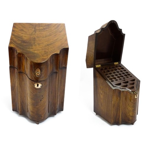 1518 - A 19thC mahogany knife box with a serpentine front opening to reveal a fitted interior, and raised o... 