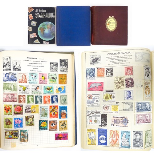 2477 - Stamps & Postal History : Three albums containing assorted 20thC Worldwide and Commonwealth stamps t... 