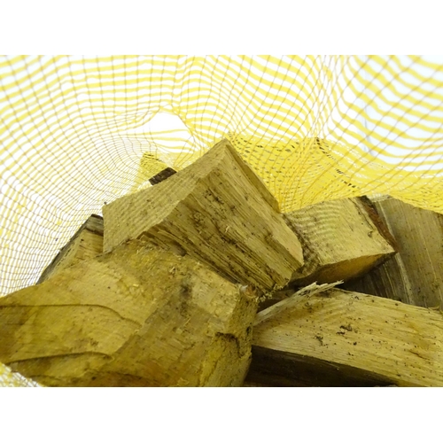 547 - Firewood : A bag of logs. Bag approx. 27