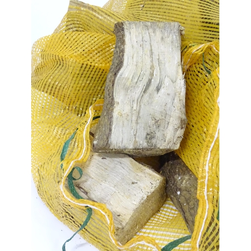 547 - Firewood : A bag of logs. Bag approx. 27