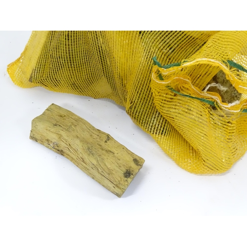 548 - Firewood : A bag of logs. Bag approx. 27