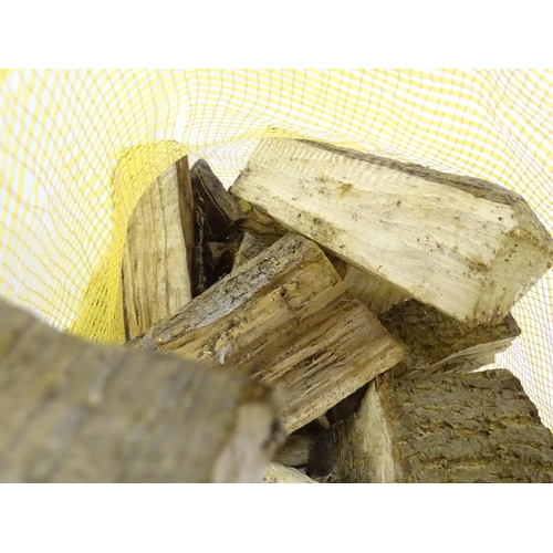 548 - Firewood : A bag of logs. Bag approx. 27