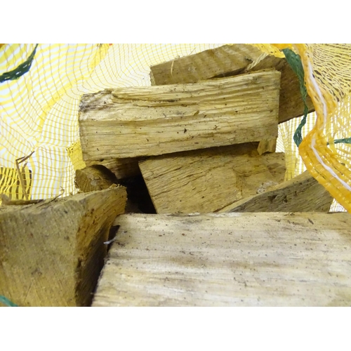 549 - Firewood : A bag of logs. Bag approx. 27