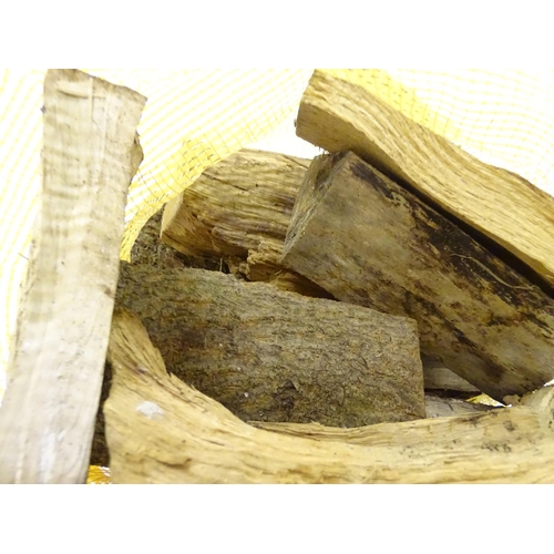 550 - Firewood : A bag of logs. Bag approx. 27