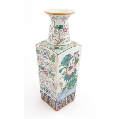 16 - A Chinese famille rose vase of squared form decorated with flowers, foliage and birds. Character mar... 