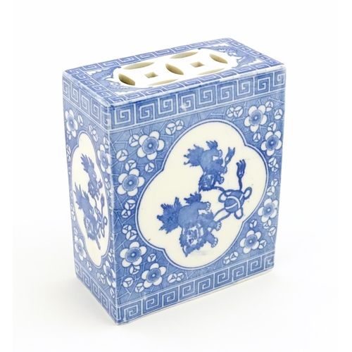 19 - A Chinese blue and white flower brick decorated with foo dogs / guardian lions and flower blossom. A... 