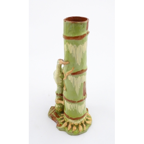 123 - A C. H. Brannam Barum art pottery spill vase of bamboo form with heron bird detail. Signed and dated... 