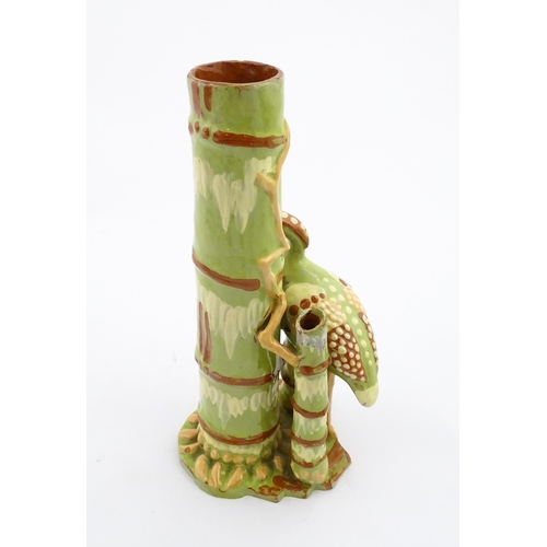 123 - A C. H. Brannam Barum art pottery spill vase of bamboo form with heron bird detail. Signed and dated... 