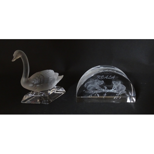 197 - Two Mats Jonasson paperweights one with polar bear detail, the other with cheetah. Together with a N... 