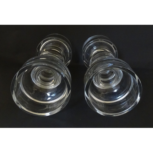 205 - A matched pair of glass candle holders of pillar form. In the Scandinavian style. Approx. 9 3/4