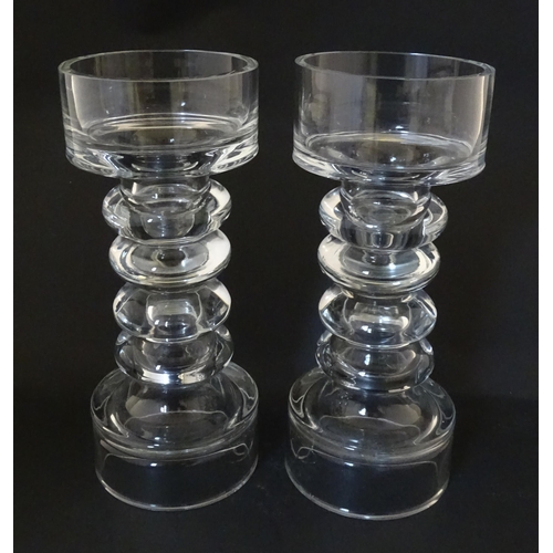 205 - A matched pair of glass candle holders of pillar form. In the Scandinavian style. Approx. 9 3/4