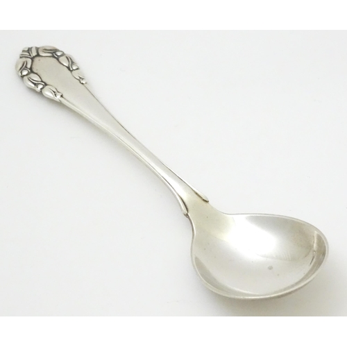 312 - Scandinavian silver : A Danish silver jam Spoon by Georg Jensen decorated in the Lily of the Valley ... 