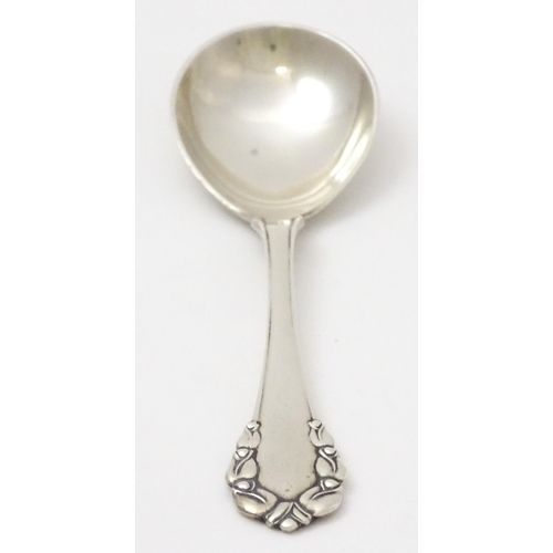 312 - Scandinavian silver : A Danish silver jam Spoon by Georg Jensen decorated in the Lily of the Valley ... 