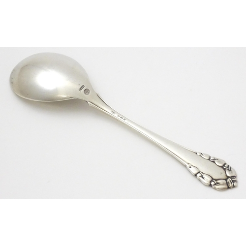 312 - Scandinavian silver : A Danish silver jam Spoon by Georg Jensen decorated in the Lily of the Valley ... 