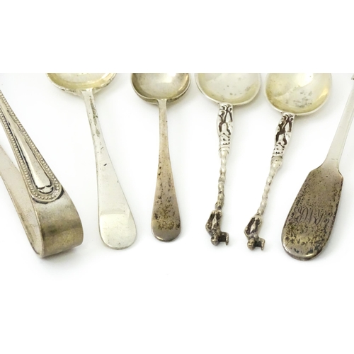 424 - A quantity of assorted silver items to include sugar tongs hallmarked Sheffield 1956, maker Viner's ... 