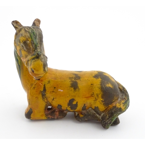 14 - A Chinese terracotta model of a Tang style horse. Approx. 4 3/4