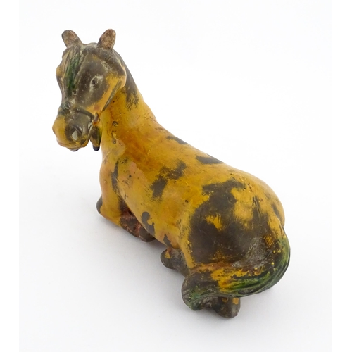 14 - A Chinese terracotta model of a Tang style horse. Approx. 4 3/4