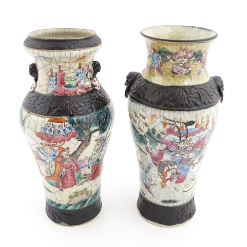 17 - Two Chinese twin handled vases with crackle glaze, decorated with figures in a landscape and auspici... 