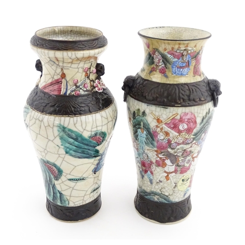 17 - Two Chinese twin handled vases with crackle glaze, decorated with figures in a landscape and auspici... 