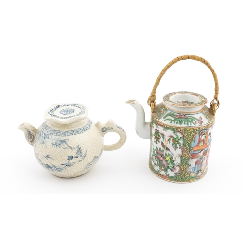 33 - A Chinese / Cantonese teapot decorated with figures, birds and flowers. Together with a Chinese blue... 