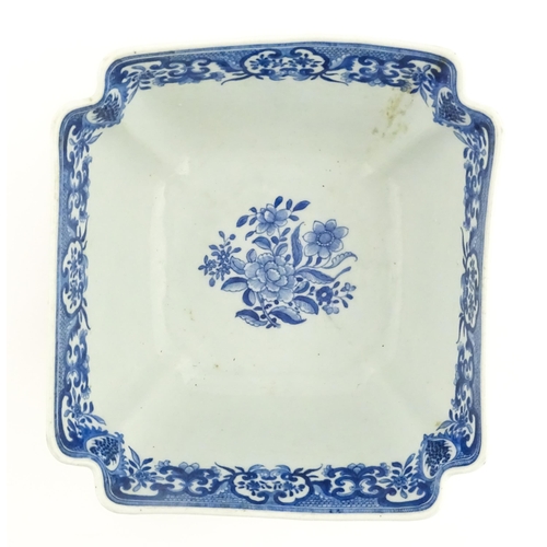 38 - A Chinese blue and white bowl of squared form decorated with flowers, foliage, taihu rock, bats in f... 