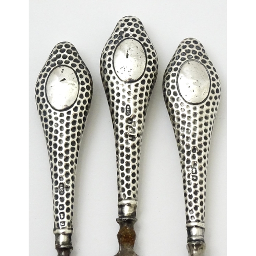 436 - Three silver handled dressing table items comprising button hook, tweezers and nail file, hallmarked... 