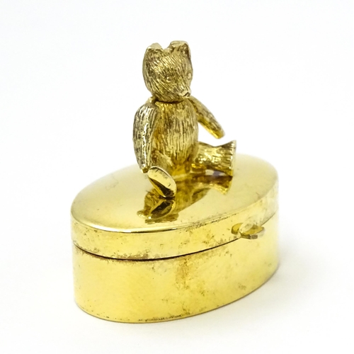 445 - A silver gilt pill box with teddy bear to top, hallmarked London 2001, maker Douglas Pell Silverware... 