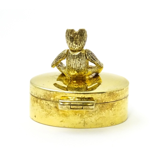 445 - A silver gilt pill box with teddy bear to top, hallmarked London 2001, maker Douglas Pell Silverware... 