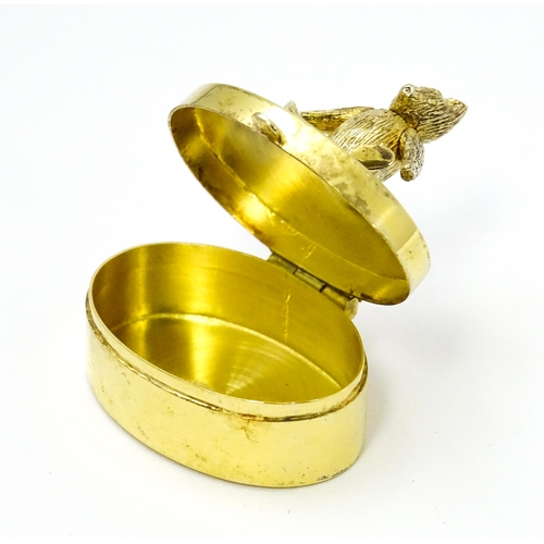 445 - A silver gilt pill box with teddy bear to top, hallmarked London 2001, maker Douglas Pell Silverware... 