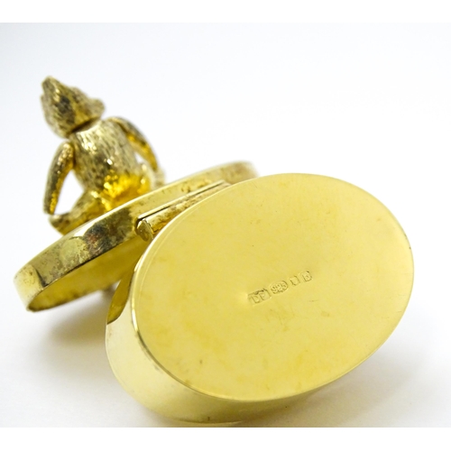 445 - A silver gilt pill box with teddy bear to top, hallmarked London 2001, maker Douglas Pell Silverware... 